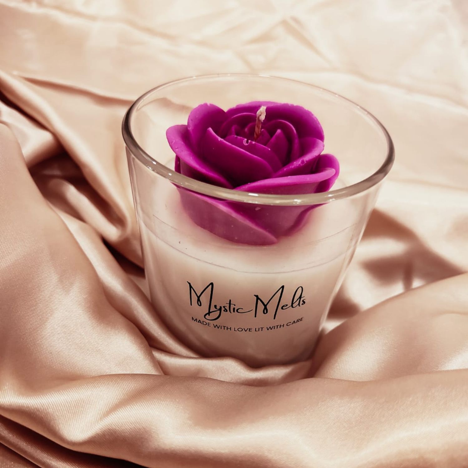 Beautiful jar candle adorned with rose on top